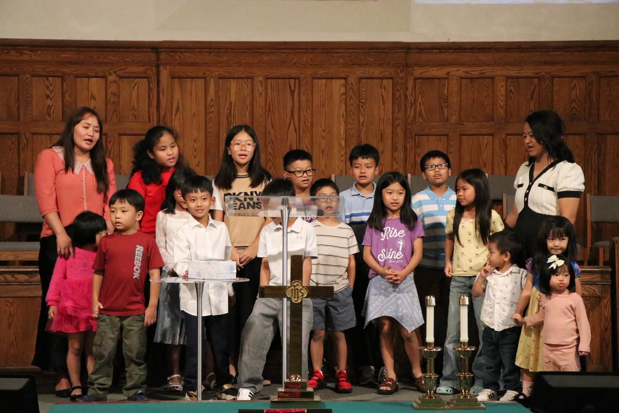Children singing together at Zomi Christian Church